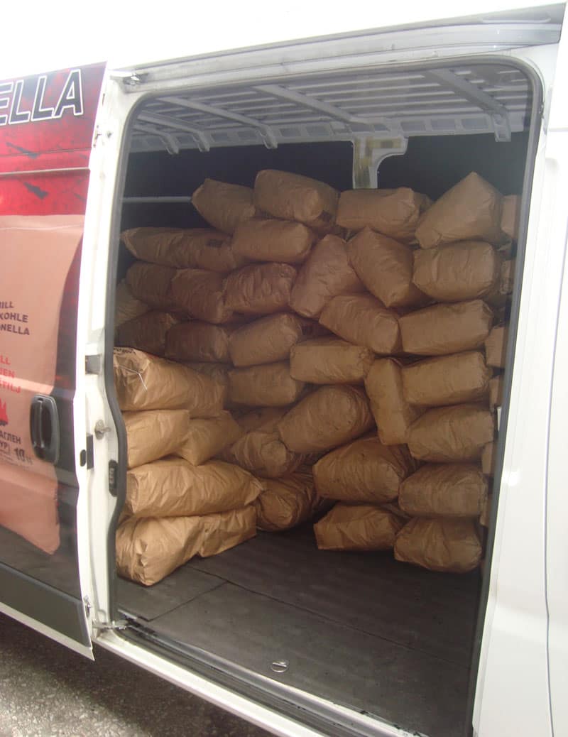Branded delivery van loaded with charcoal