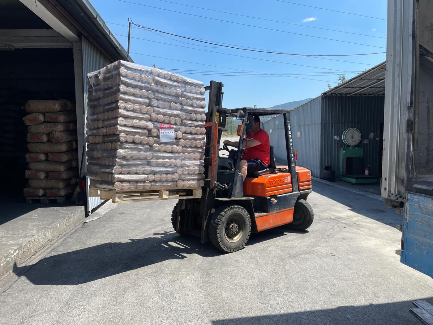Forklift moving a loaded pallet