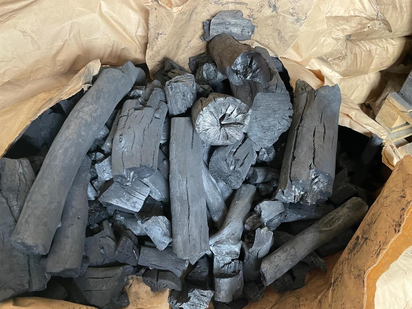Large charcoal lumps in a paper bag