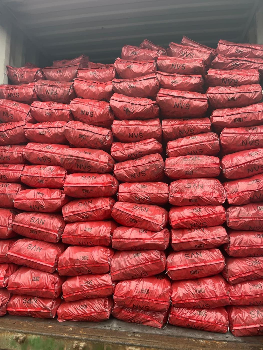 Warehouse stacked with retail charcoal bags